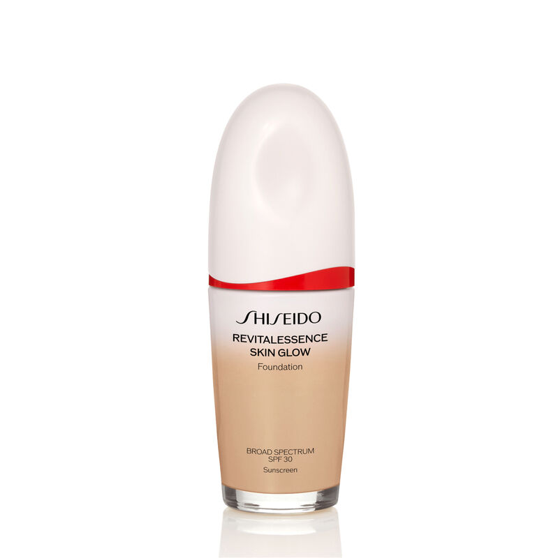 An oval-shaped bottle of Shiseido Revitalessence Skin Glow Foundation SPF 30 in shade 260 Cashmere. The label on the bottle is white with a red accent. The text on the label reads the product&rsquo;s title, and its sunscreen protection.