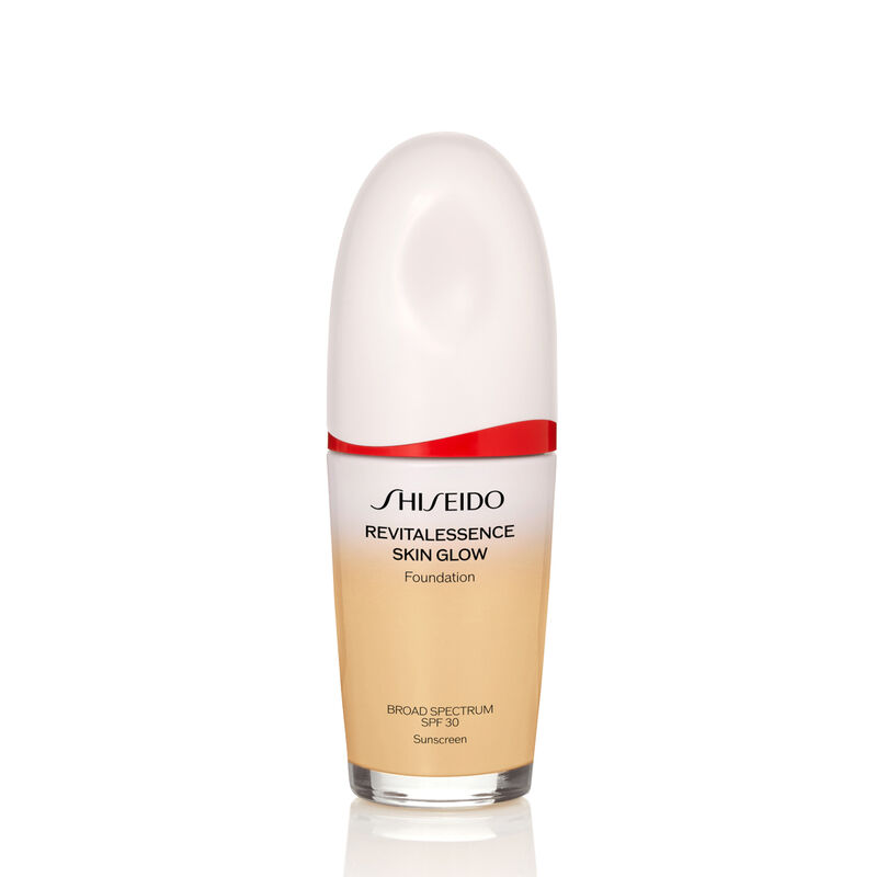 An oval-shaped bottle of Shiseido Revitalessence Skin Glow Foundation SPF 30 in shade 250 Sand. The label on the bottle is white with a red accent. The text on the label reads the product&rsquo;s title, and its sunscreen protection.